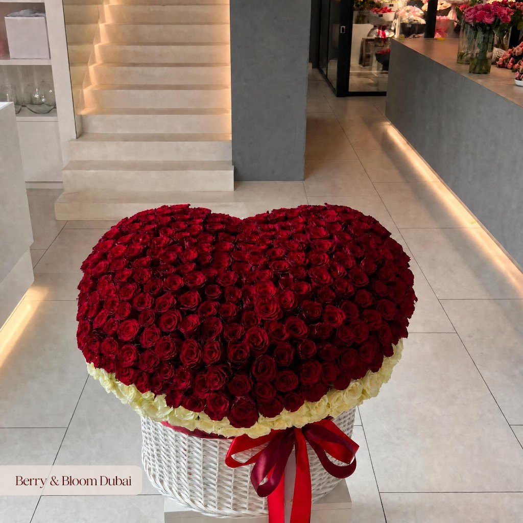 The grand heart basket of red and white roses